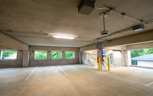 Interior view of a corner of the parking garage with a staircase