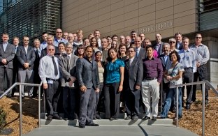 A large group of people standing outside a building. 