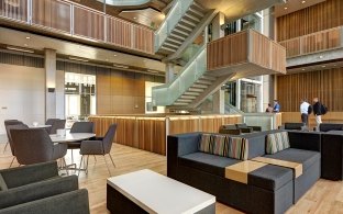 UCSD Biomedical Research Facility Gathering Space with Tables, Chairs, Couches