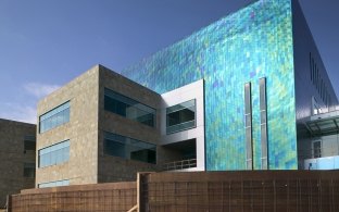 A bright blue exterior wall of the building