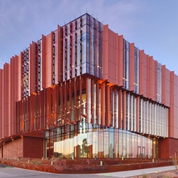 Outdoor image of the building with windows and panels sticking out