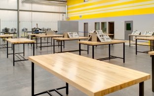 Indoor classroom with wooden tables