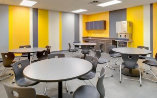 Meeting area with round tables and chairs